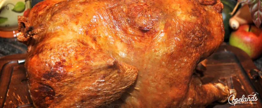 COJ - Deep-fried Thanksgiving turkey on a wooden plate